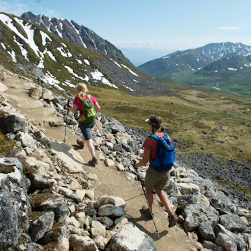 Hikers on the trail to Gold Cord Lake in Independence Mine State Historical Park at Hatcher Pass, Alaska June 2011. The half-mile trail leads to an alpine lake above the historic gold mine near Hatcher Pass.