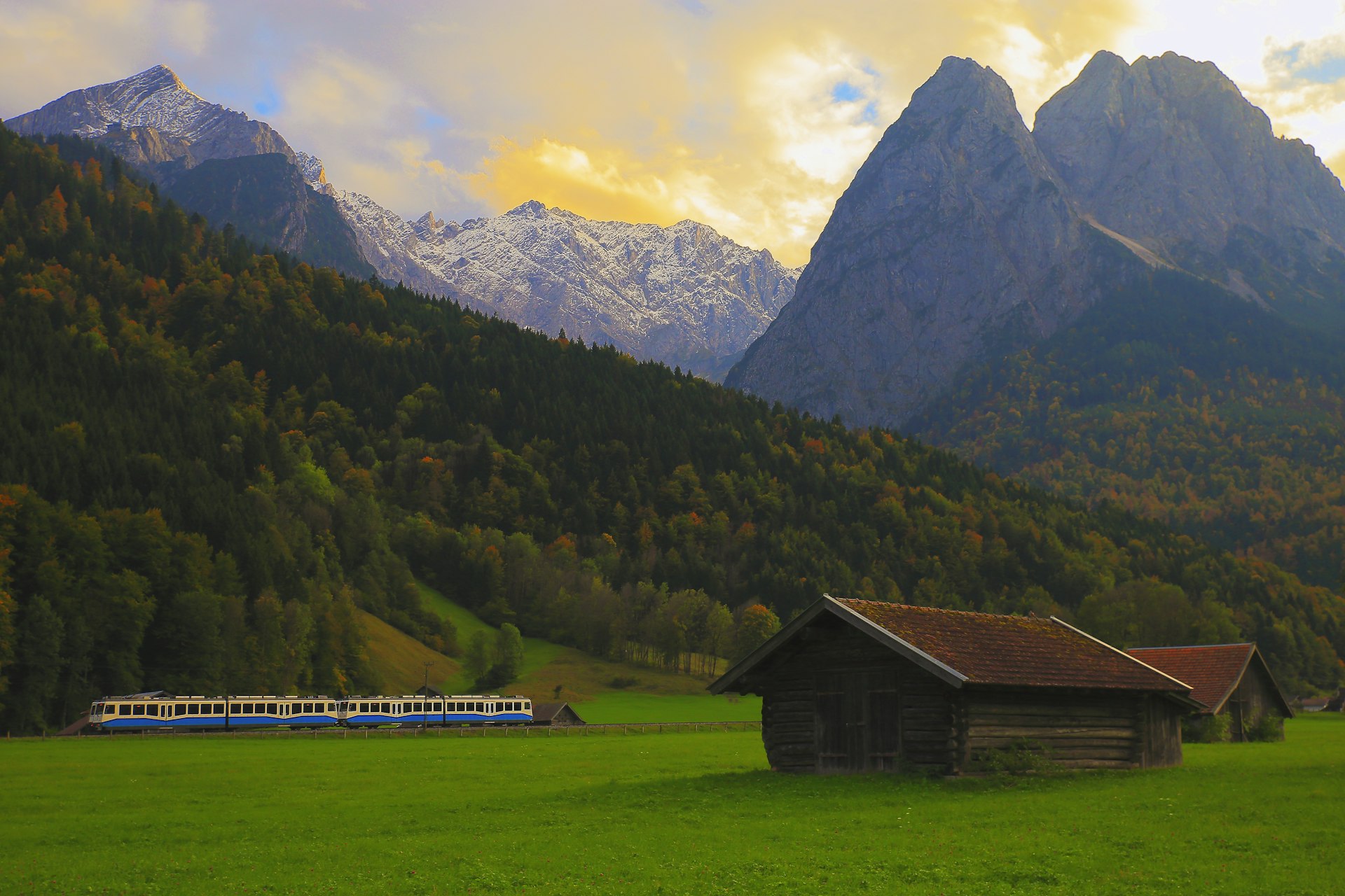 Train passing the Bavarian Alps near Garmisch-Partenkirchen, Germany