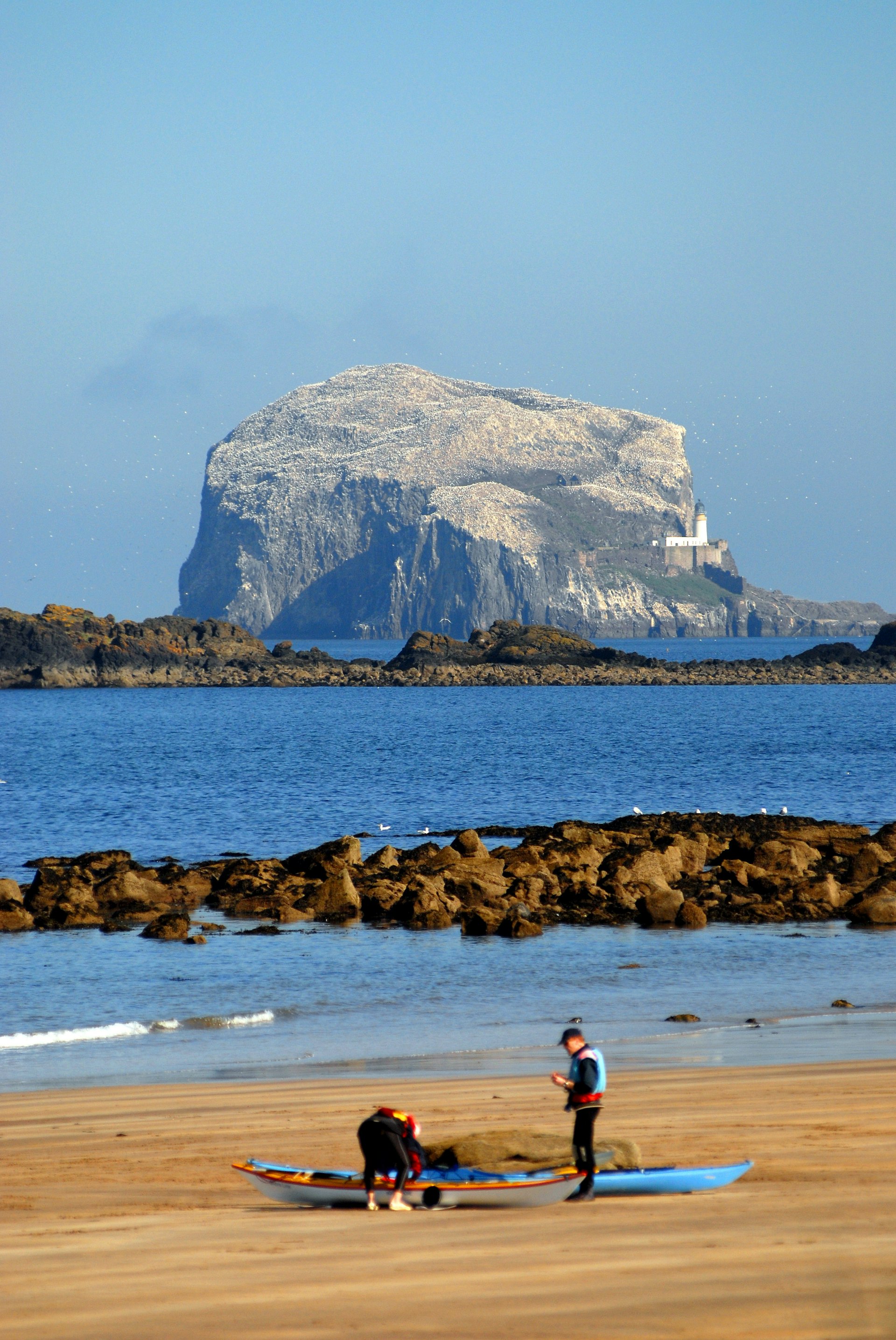 Bass rock off North Berwick at end of September white colour is thousands of gannets.