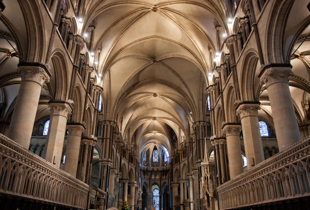 The Quire, Canterbury Cathedral An interior shot of a cathedral with a huge vaulted ceiling rising high above supported by large stone columns