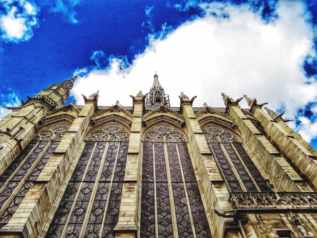 Low Angle View Of Sainte-Chapelle Against Cloudy Sky