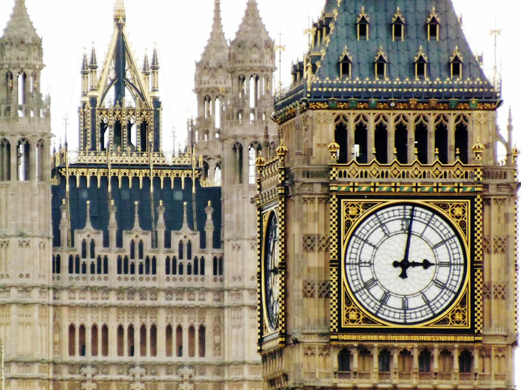 Close-up of Big Ben Close-up shot of a huge white clock face with black numbers in a Neo-Gothic tower