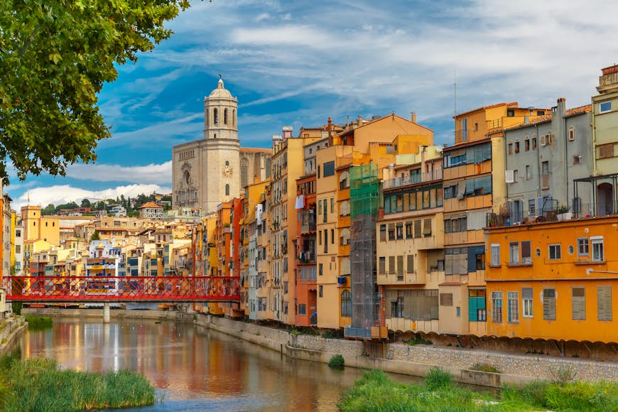 Colorful houses and the Eiffel Bridge in Girona, Catalonia, Spain