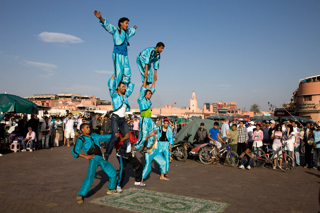 Acrobatic performers at Djemaa El Fna square in Marrakesh, Morocco Acrobatic performers at Djemaa El Fna square in Marrakesh, Morocco