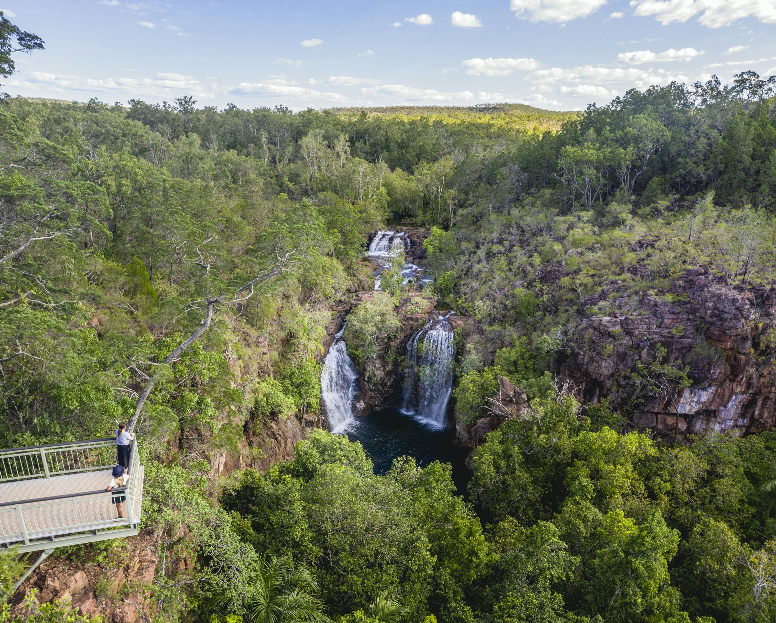 Visitors viewing Florence Falls from the lookout.<br /><br />Get set for real adventure and to connect with nature at Litchfield National Park. At just over an hour from Darwin, it's every local's favourite day trip with its waterfalls and water holes, bush walks, four-wheel drive tracks, birds and wildlife.