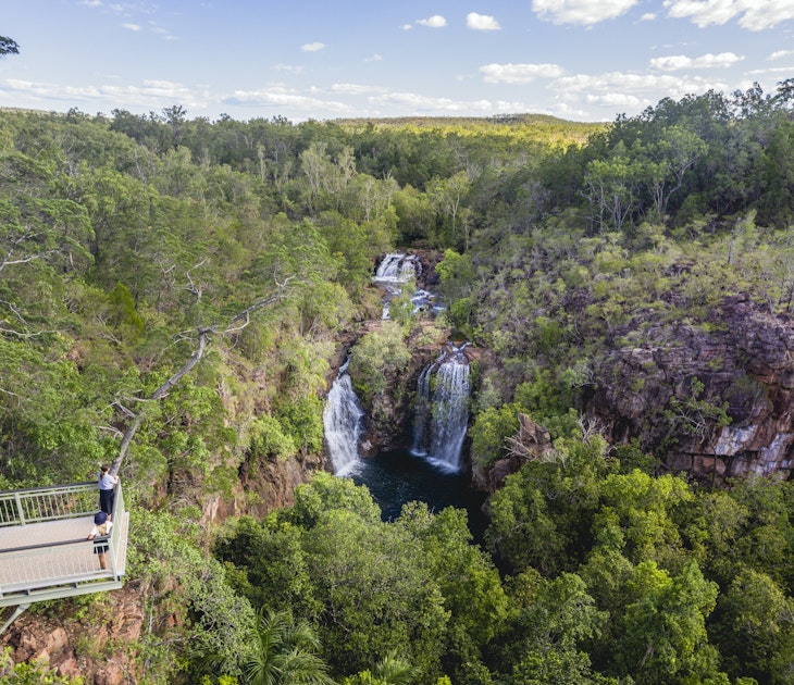 Visitors viewing Florence Falls from the lookout.<br /><br />Get set for real adventure and to connect with nature at Litchfield National Park. At just over an hour from Darwin, it's every local's favourite day trip with its waterfalls and water holes, bush walks, four-wheel drive tracks, birds and wildlife.