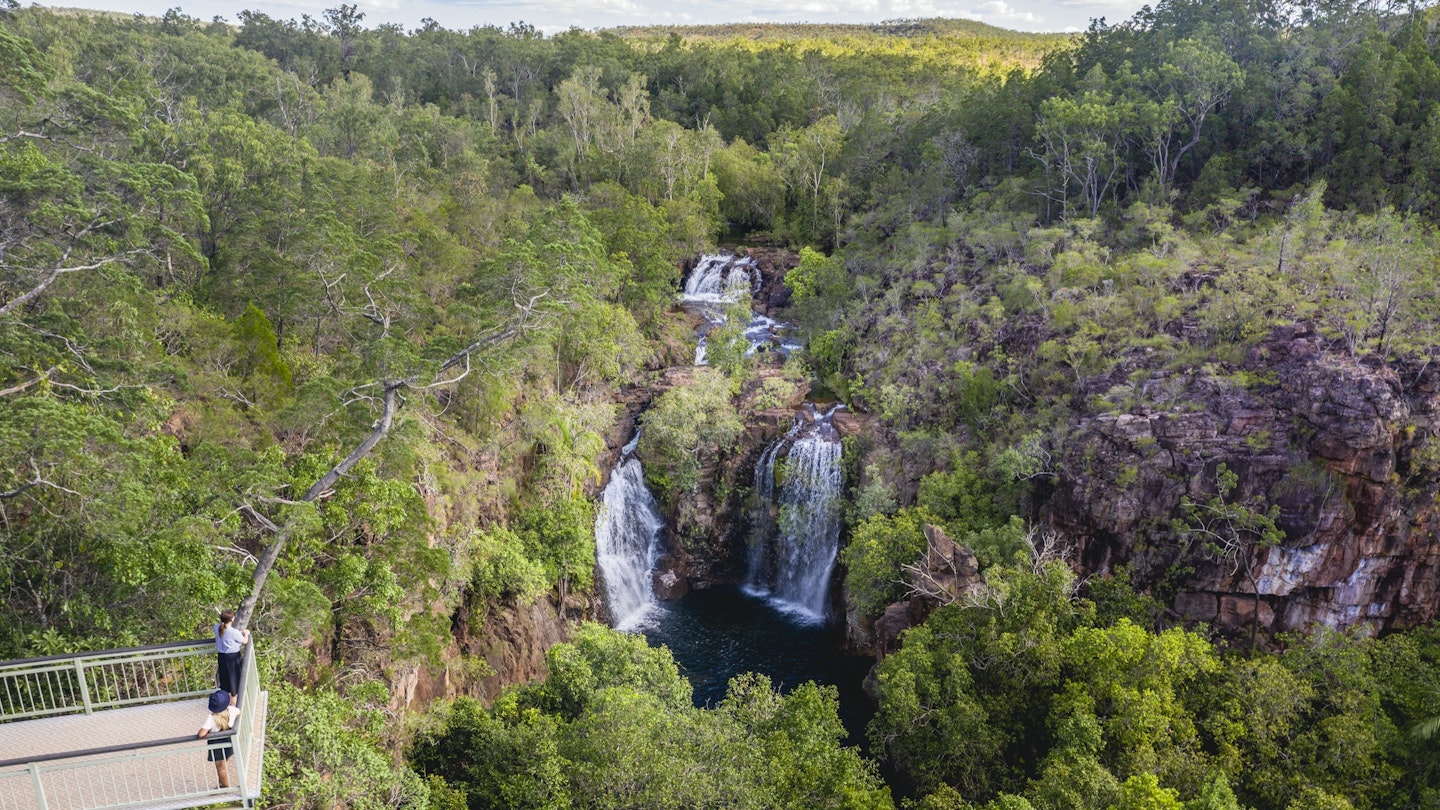 Visitors viewing Florence Falls from the lookout.<br /><br />Get set for real adventure and to connect with nature at Litchfield National Park. At just over an hour from Darwin, it's every local's favourite day trip with its waterfalls and water holes, bush walks, four-wheel drive tracks, birds and wildlife.