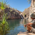 Rock pool at the Barramundi falls, Kakadu National Park, Northern Territory, Australia, one of the crocodile fre lakes in this area, where swimming is possible; Shutterstock ID 1112732693; your: Ben Buckner; gl: 65050; netsuite: Client Services; full: Northern Territory_Surprise