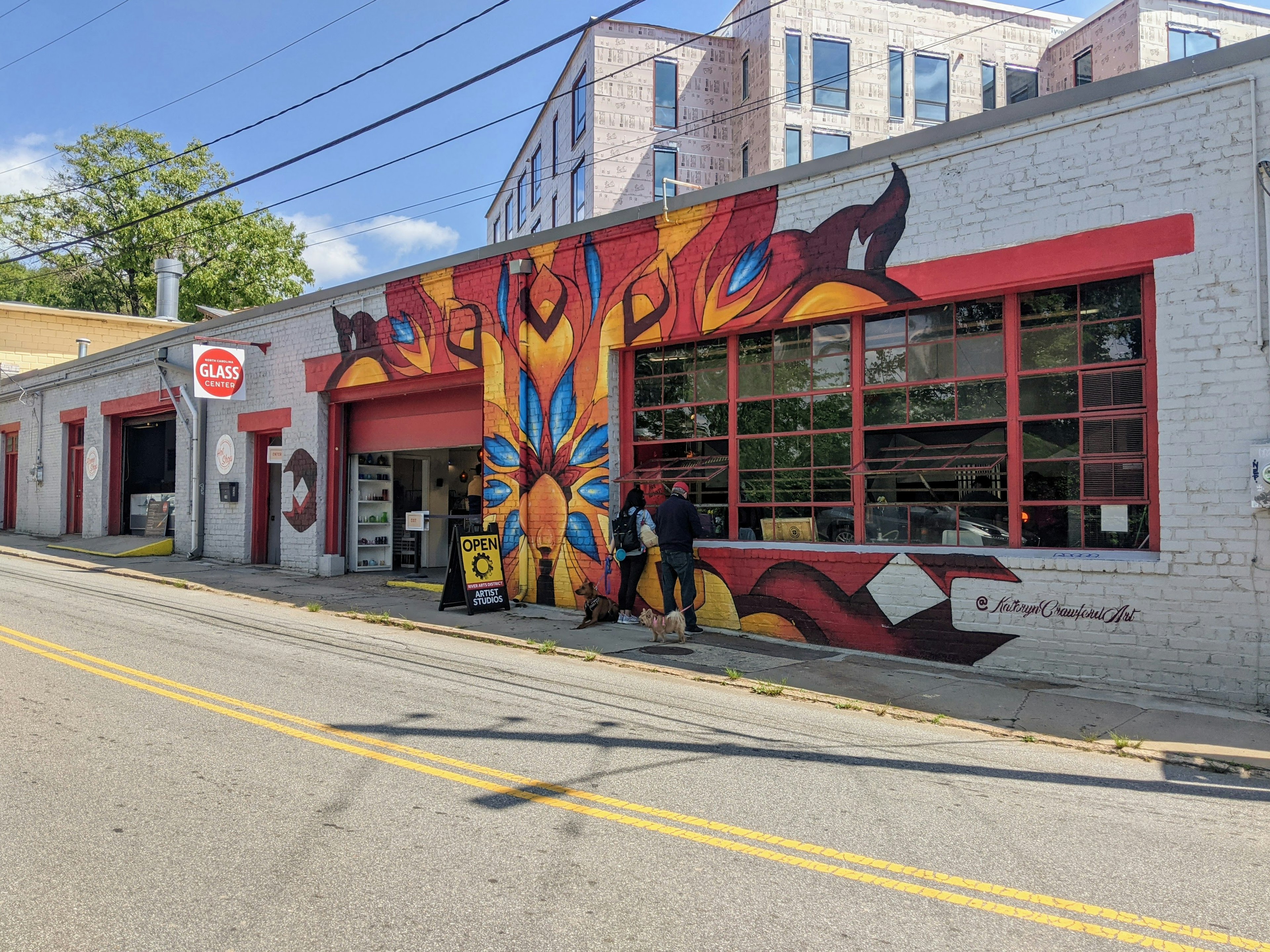 A colorful mural outside a glass studio in the River Arts District of Asheville, North Carolina