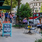10 JUNE, 2018: People dining and socializing on a sunny Sunday on Battery Park Ave.