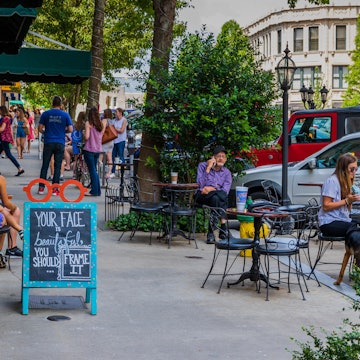 10 JUNE, 2018: People dining and socializing on a sunny Sunday on Battery Park Ave.