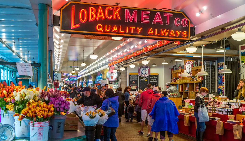 Visitors crowd stalls at Pike Place Market