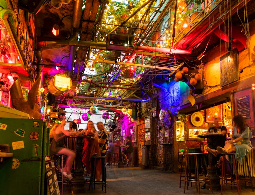 Interior of the Szimpla Kert ruin bar at night in Budapest, Hungary