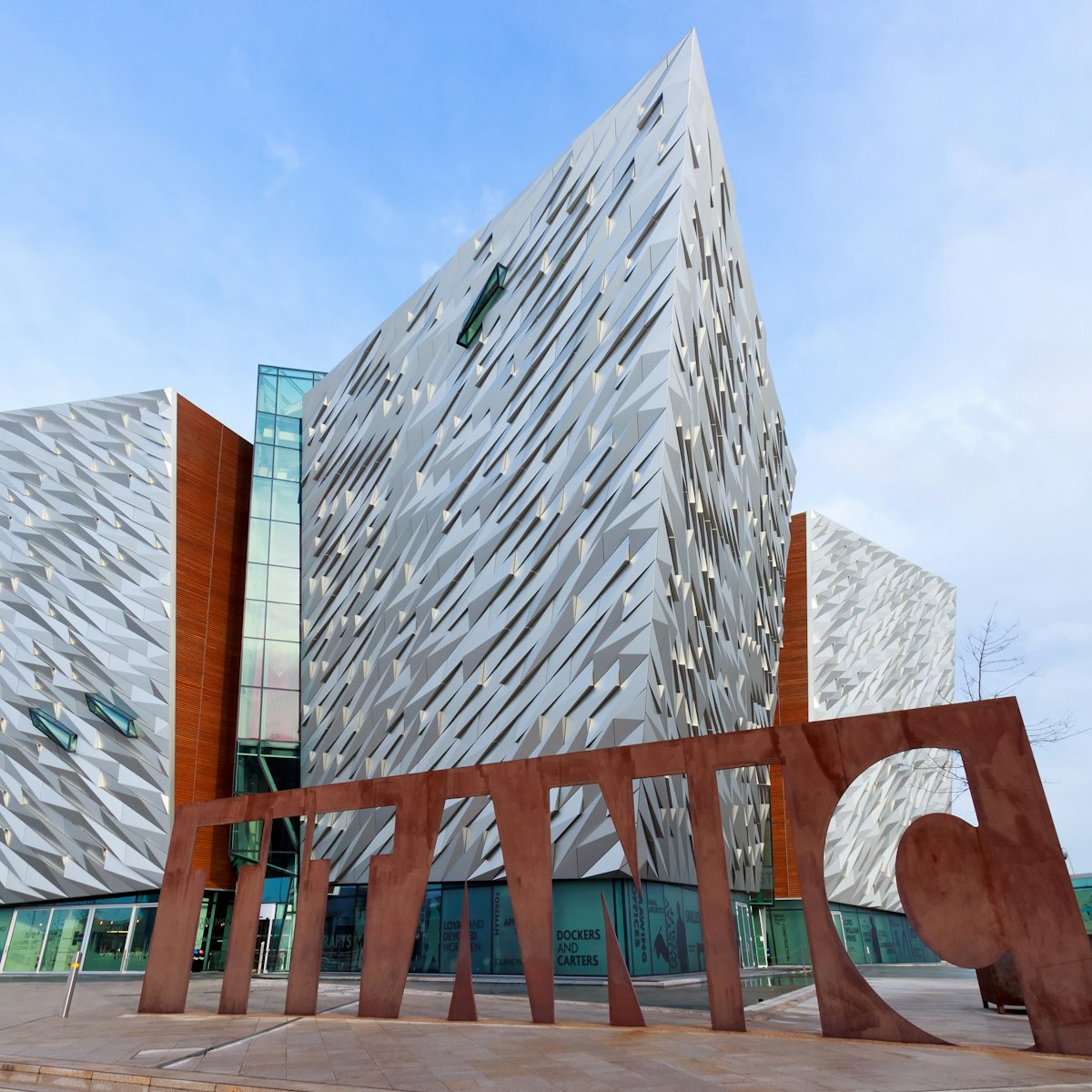 BELFAST, NORTHERN IRELAND - FEB 9, 2014: The Titanic visitor attraction and a monument in Belfast, Northern Ireland. Opened in 2012, this is the Titanic sign in front of the entrance.