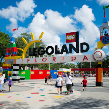 WINTER HAVEN, FL - June 18, 2014: Visitors pass through the entrance to Legoland Florida in Winter Haven, FL, on June 18, 2014.