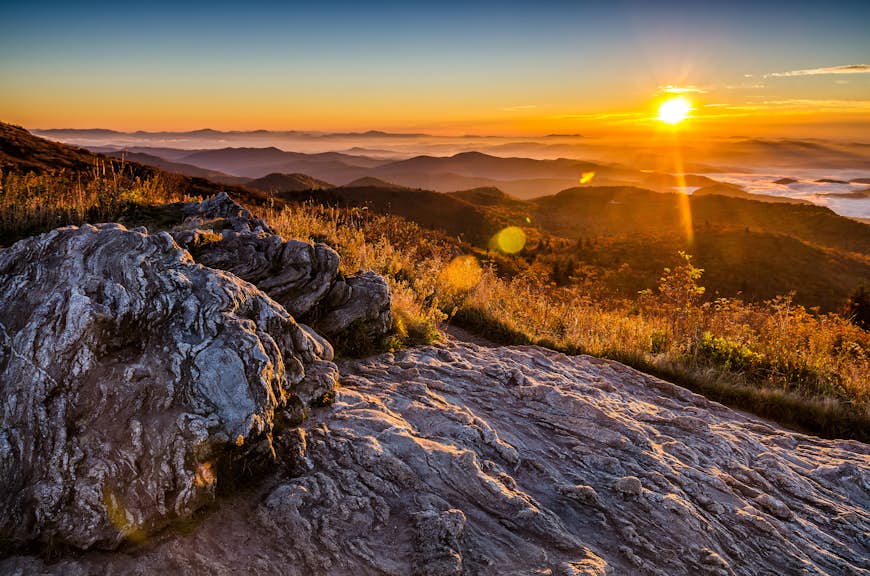 A golden fall sunrise over the Blue Ridge Mountains, from atop Black Balsam Knob in the Pisgah National Forest