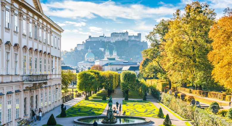 Beautiful view of famous Mirabell Gardens with the old historic Fortress Hohensalzburg in the background in Salzburg, Austria