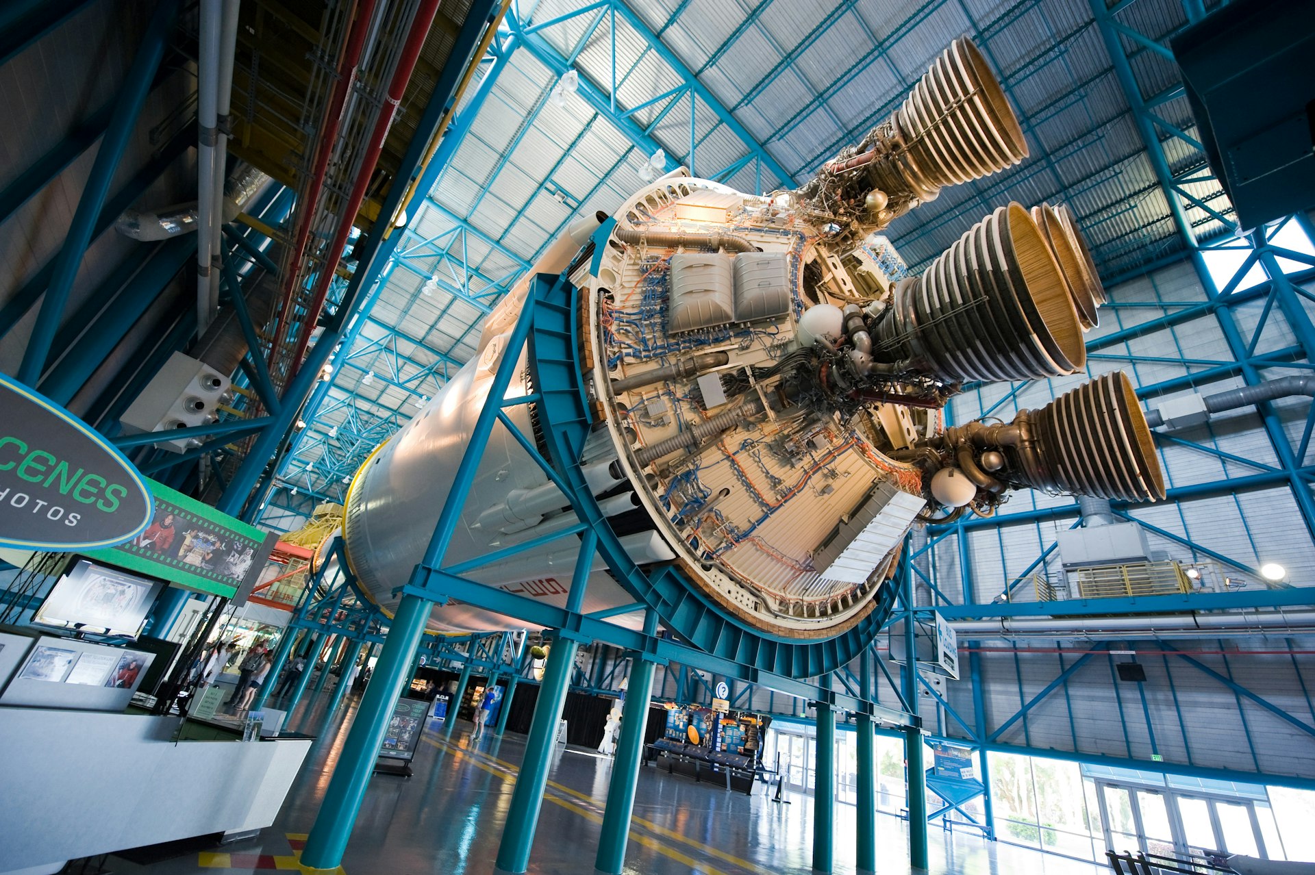 An exhibit of a spacecraft hanging from the ceiling