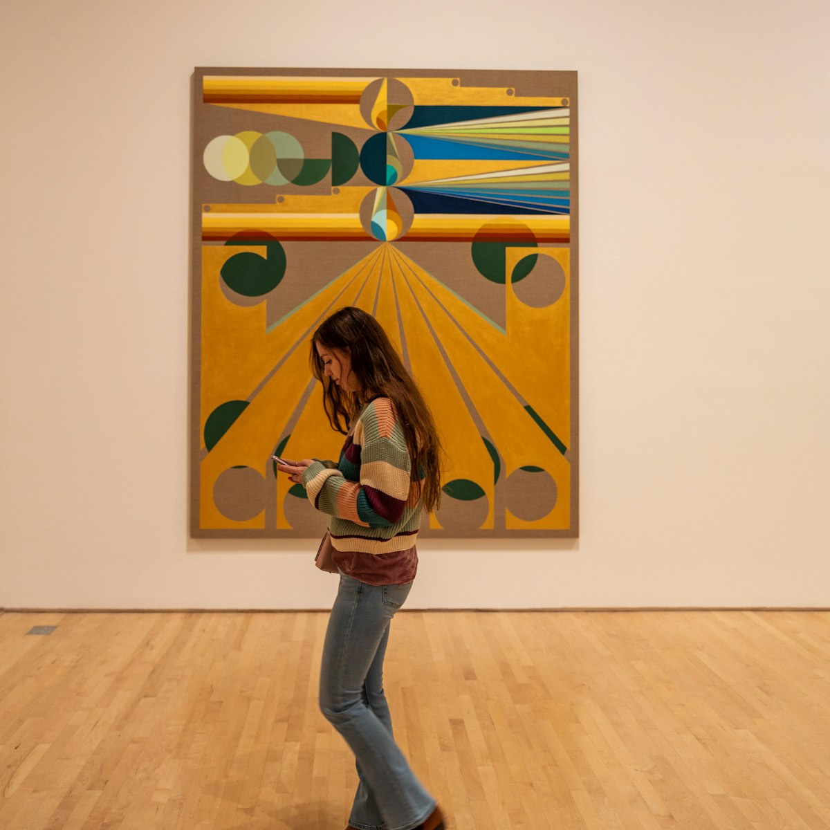 SAN FRANCISCO, USA - December 8, 2019, visitors are similar in color to the artifacts in question at the California Museum of Modern Art, a girl walks past the picture.; Shutterstock ID 1622086819; your: Meghan O'Dea; gl: 65050; netsuite: Online Editorial; full: POI page