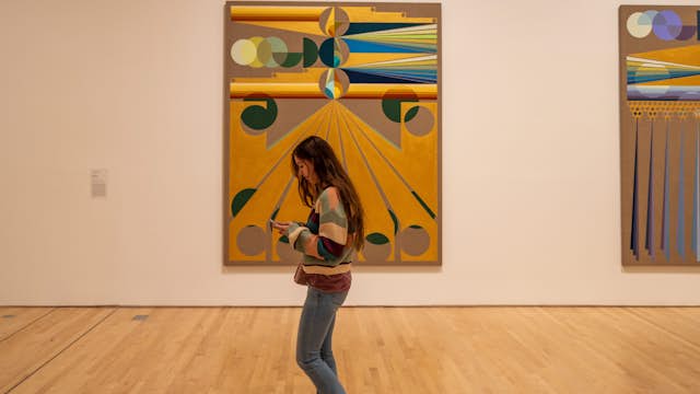 SAN FRANCISCO, USA - December 8, 2019, visitors are similar in color to the artifacts in question at the California Museum of Modern Art, a girl walks past the picture.; Shutterstock ID 1622086819; your: Meghan O'Dea; gl: 65050; netsuite: Online Editorial; full: POI page