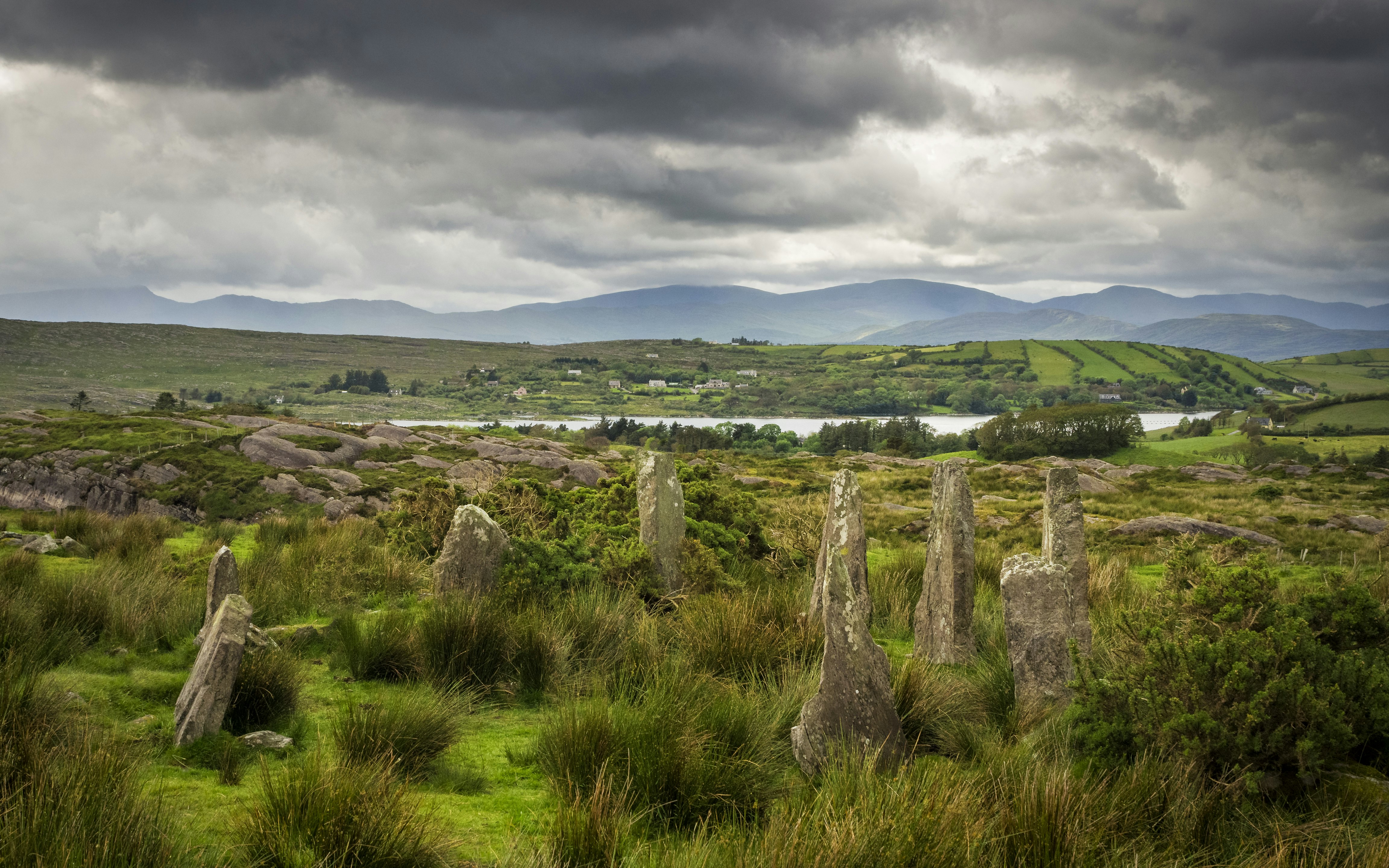 Stone circle in the middle of a wild, green landscape