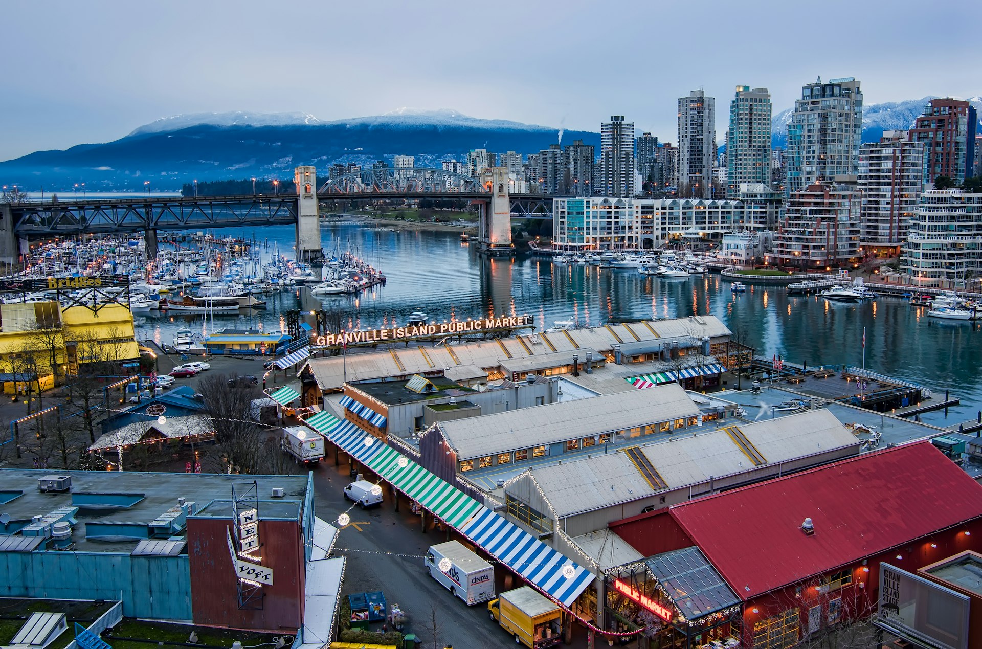 An aerial view of a market along a beautiful coastline. 