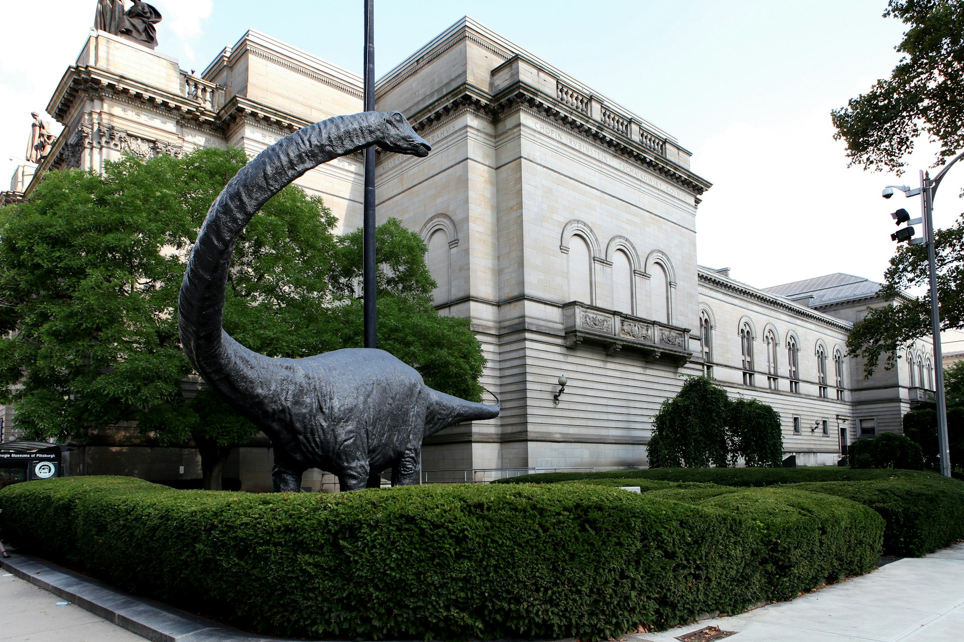 A huge dinosaur sits outside the Carnegie Museum of Natural History in Pittsburgh, Pennsylvania 