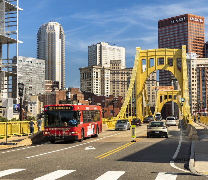 Pittsburgh, Pennsylvania - June 23 2019:  Traffic, cars and people cross the Allegheny River on the Roberto Clemente Bridge in downtown Pittsburgh Pennsylvania USA