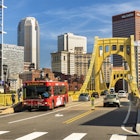 Pittsburgh, Pennsylvania - June 23 2019: Traffic, cars and people cross the Allegheny River on the Roberto Clemente Bridge in downtown Pittsburgh Pennsylvania USA