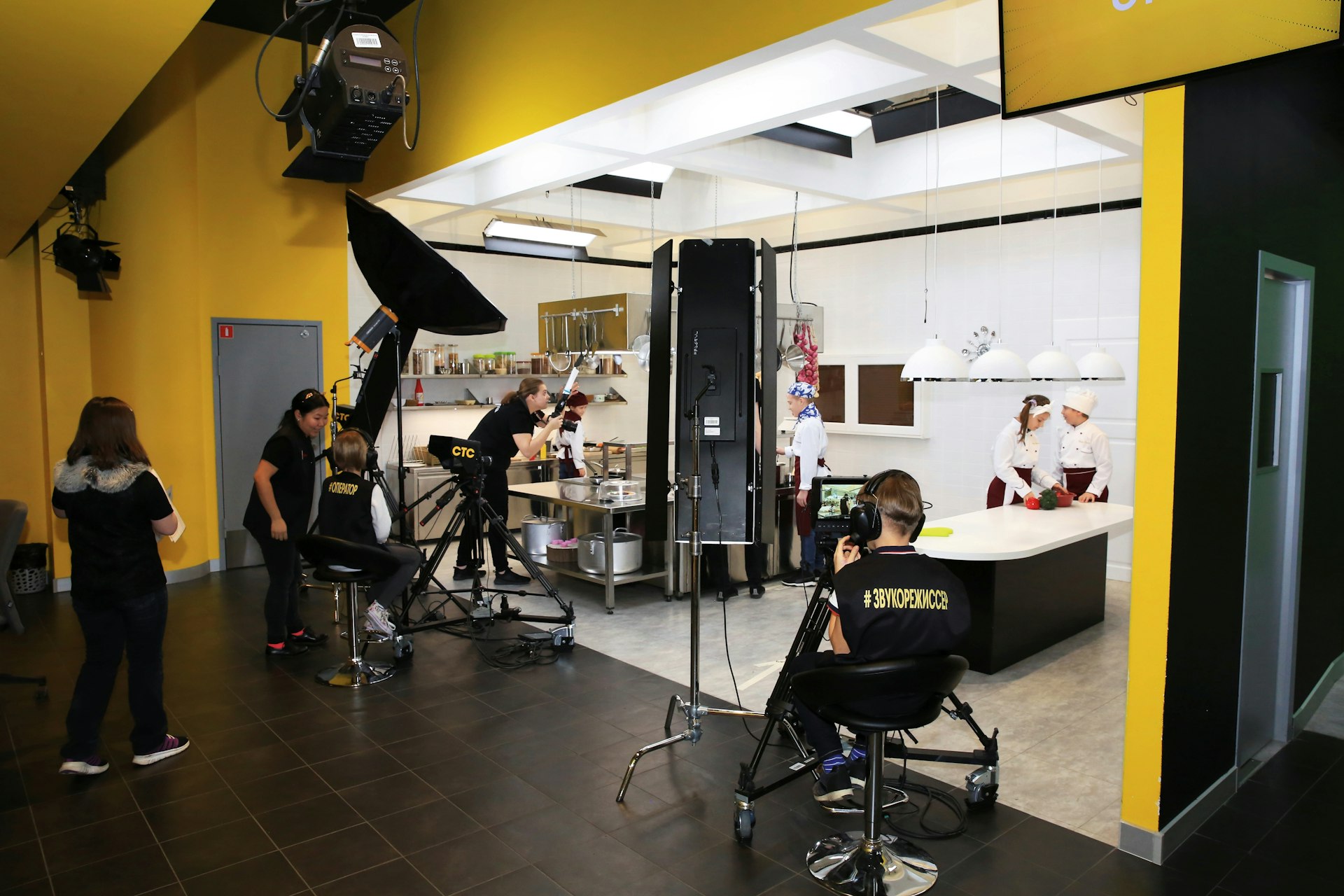 Children pretending to record a cooking TV show at KidZania, an amusement park that introduces children to the world of work in Moscow, Russia