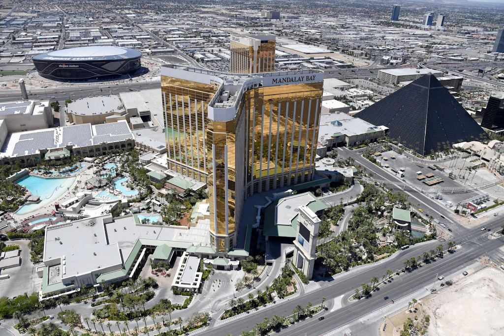 An aerial view shows Allegiant Stadium under construction west of Mandalay Bay Resort and Casino, Delano Las Vegas at Mandalay Bay Resort and Casino and Luxor Hotel and Casino
