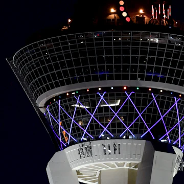 LAS VEGAS, NEVADA - DECEMBER 21: Jupiter (L) and Saturn appear about one-tenth of a degree apart during an astronomical event known as a Great Conjunction to the left of The STRAT Hotel, Casino & SkyPod on December 21, 2020 in Las Vegas, Nevada. The planets, which remain about 450 million miles apart in space, have not appeared this close together from Earth's vantage point since 1623, and it's been nearly 800 years since the alignment occurred at night. The conjunction, which occurs on the night of the winter solstice by coincidence, has become known popularly as the "Christmas Star." The gas giants will not appear this close together again until 2080. (Photo by Ethan Miller/Getty Images)