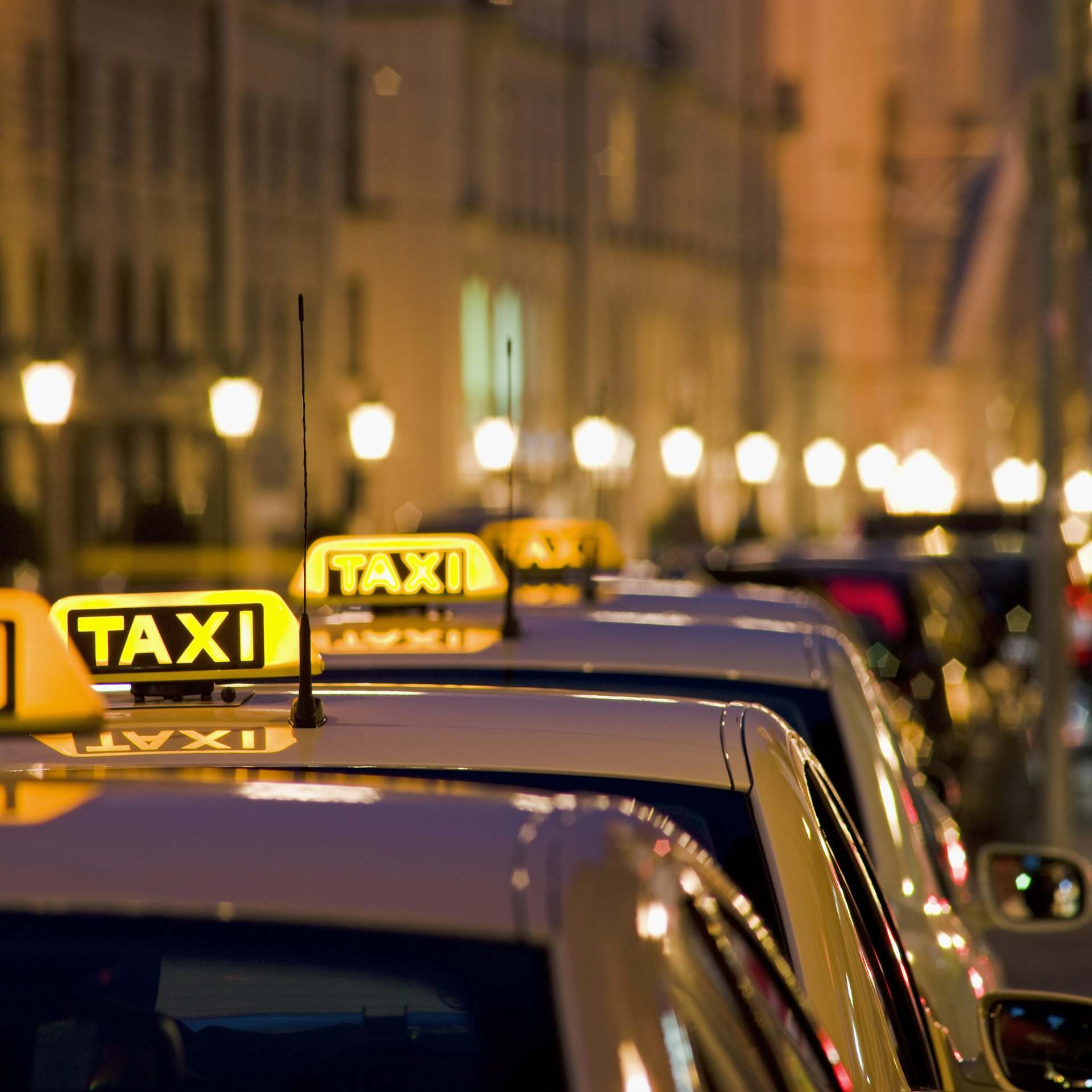 Illuminated taxi signs on Maximilian Street in Munich, Germany