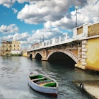 Arch bridge over a river in Tarantò.