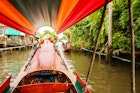 Trip through Bangkok canals down the Chao Phraya river on longtail boat