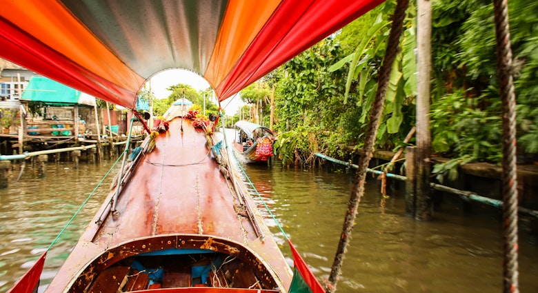 Trip through Bangkok canals down the Chao Phraya river on longtail boat