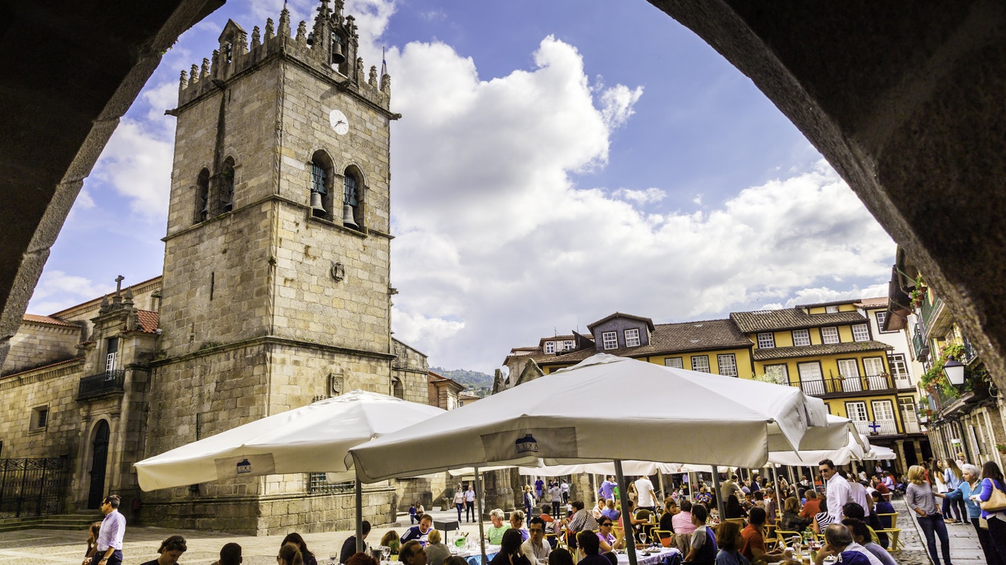 October 5, 2014: Guimarães city square, with visitors seated in outdoor restaurants.