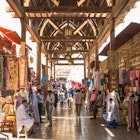 Textile souk crowded with people at daytime, Bur Dubai, Dubai, United Arab Emirates