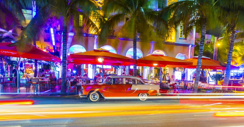 Miam, United States - July 31, 2013: Night view at Ocean drive  in Miami Beach, Florida. Old vintage cars park in the Art Deco district,the main tourist attraction in Miami.