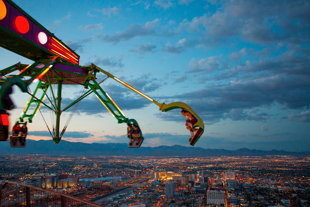 Insanity, a green claw-like ride swings out into the sky on top of the STRAT hotel in Las Vegas.
