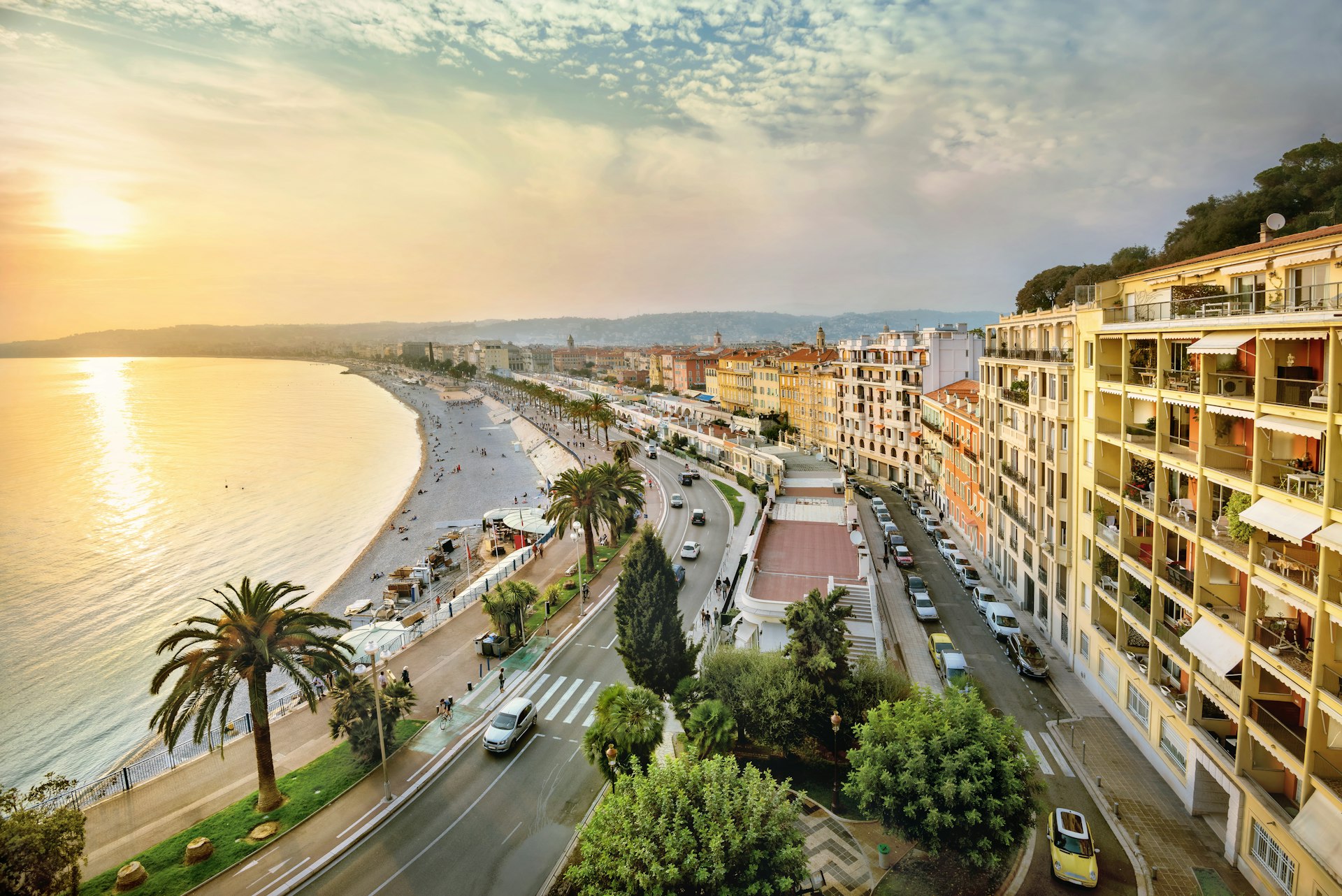 An overhead shot of the sunset over the Promenade des Anglais and Opéra Beach in Nice, Côte d’Azur, France