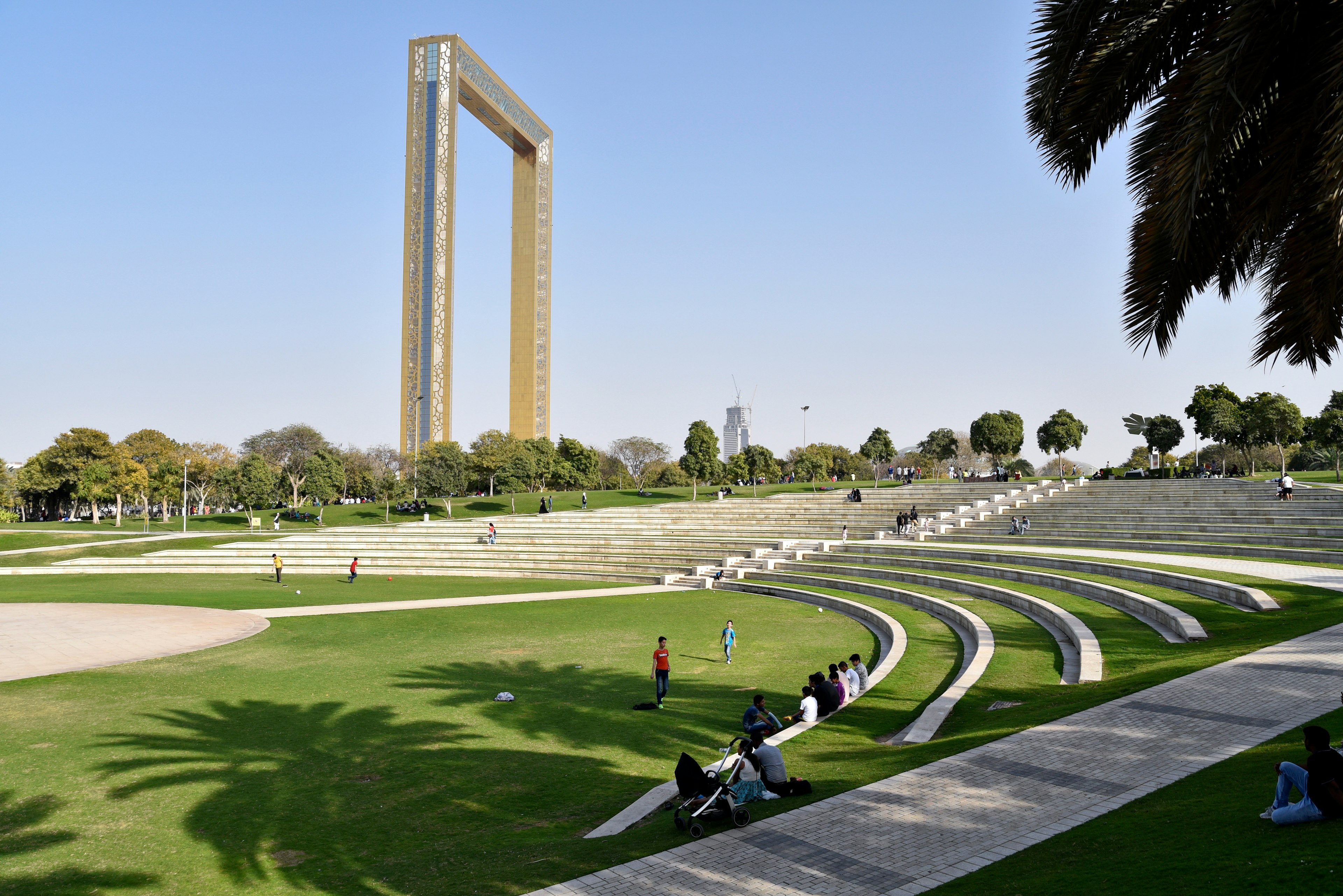 A gigantic rectangular picture frame in the middle of a green park