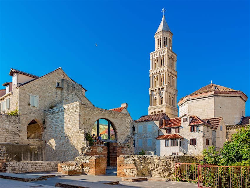 St Domnius Cathedral, Diocletian's Palace A white bell square tower rises above a Roman city