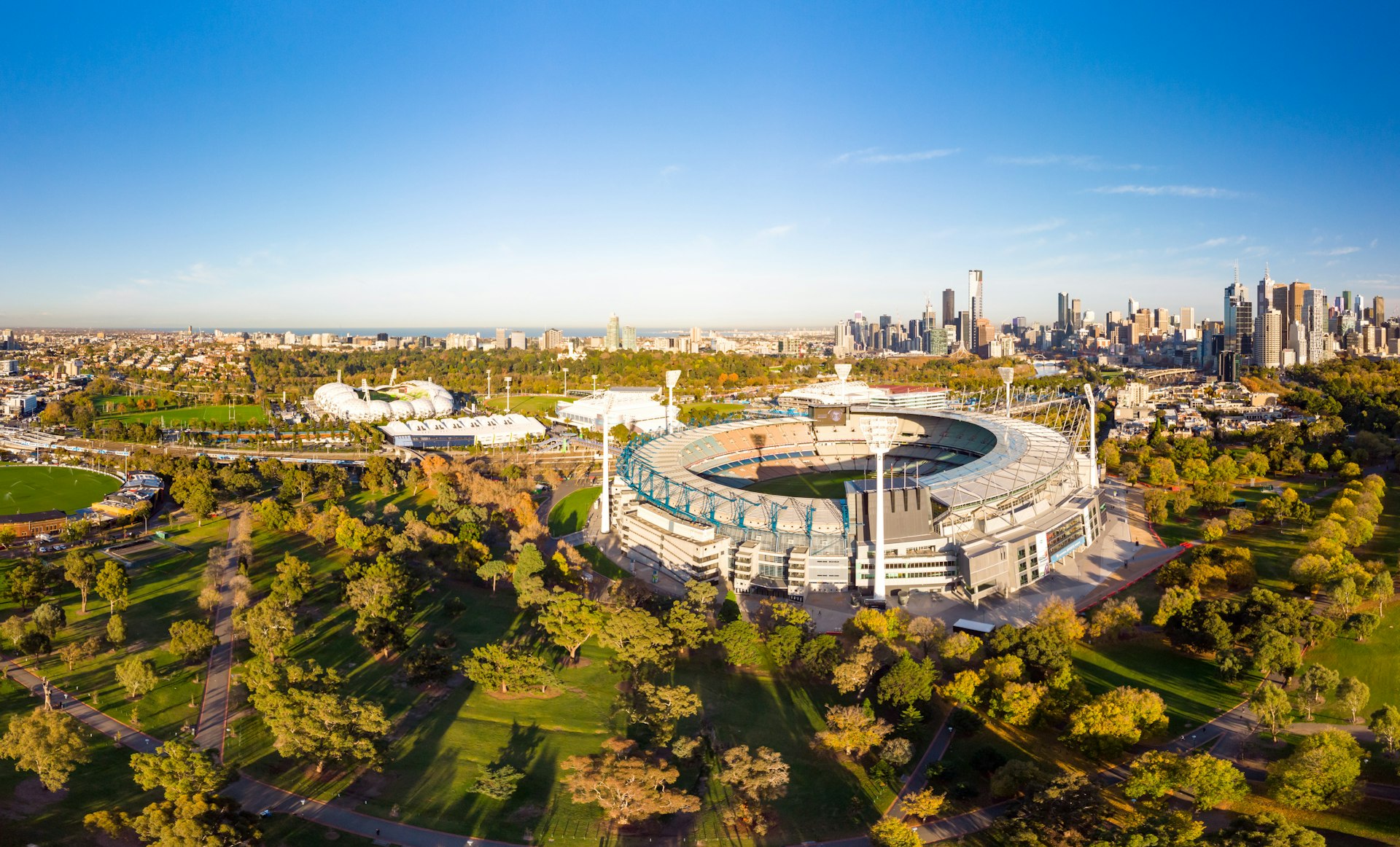 Melbourne's famous skyline with Melbourne Cricket Ground stadium in the foreground on a cool autumn morning in Melbourne, Victoria, Australia.