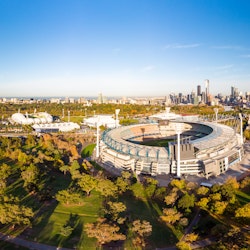 MELBOURNE, AUSTRALIA - MAY 30: Melbourne's famous skyline with Melbourne Cricket Ground stadium in the foreground on a cool autumn morning in Melbourne, Victoria, Australia on May 30th 2018.