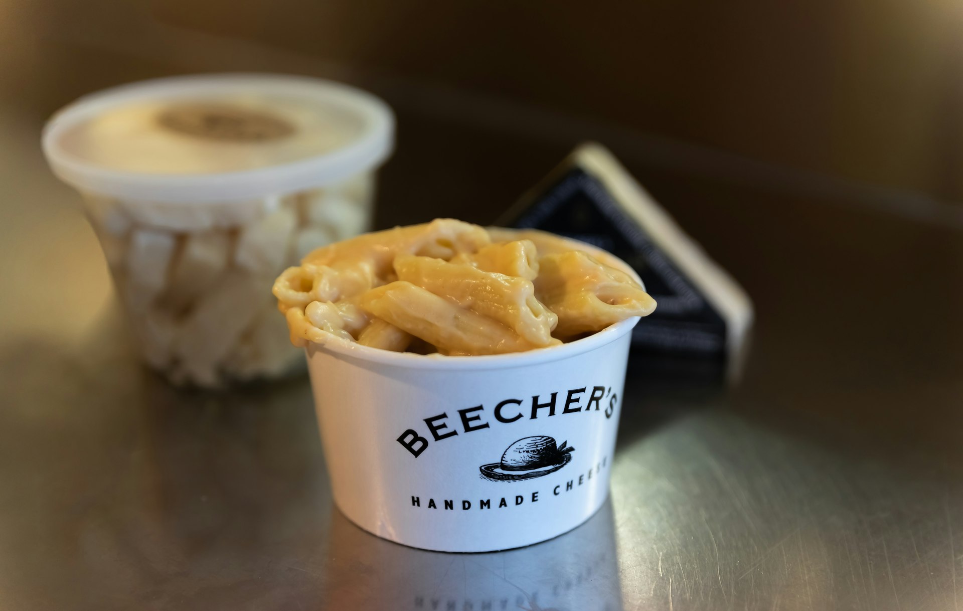 Cup of steaming hot mac and cheese at the famous Beecher's Handmade Cheese store in Pike Place Market, Seattle