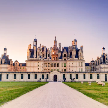 The royal Chateau de Chambord in the evening, France. This castle is located in the Loire Valley, was built in the 16th century and is one of the most recognizable chateaux in the world.