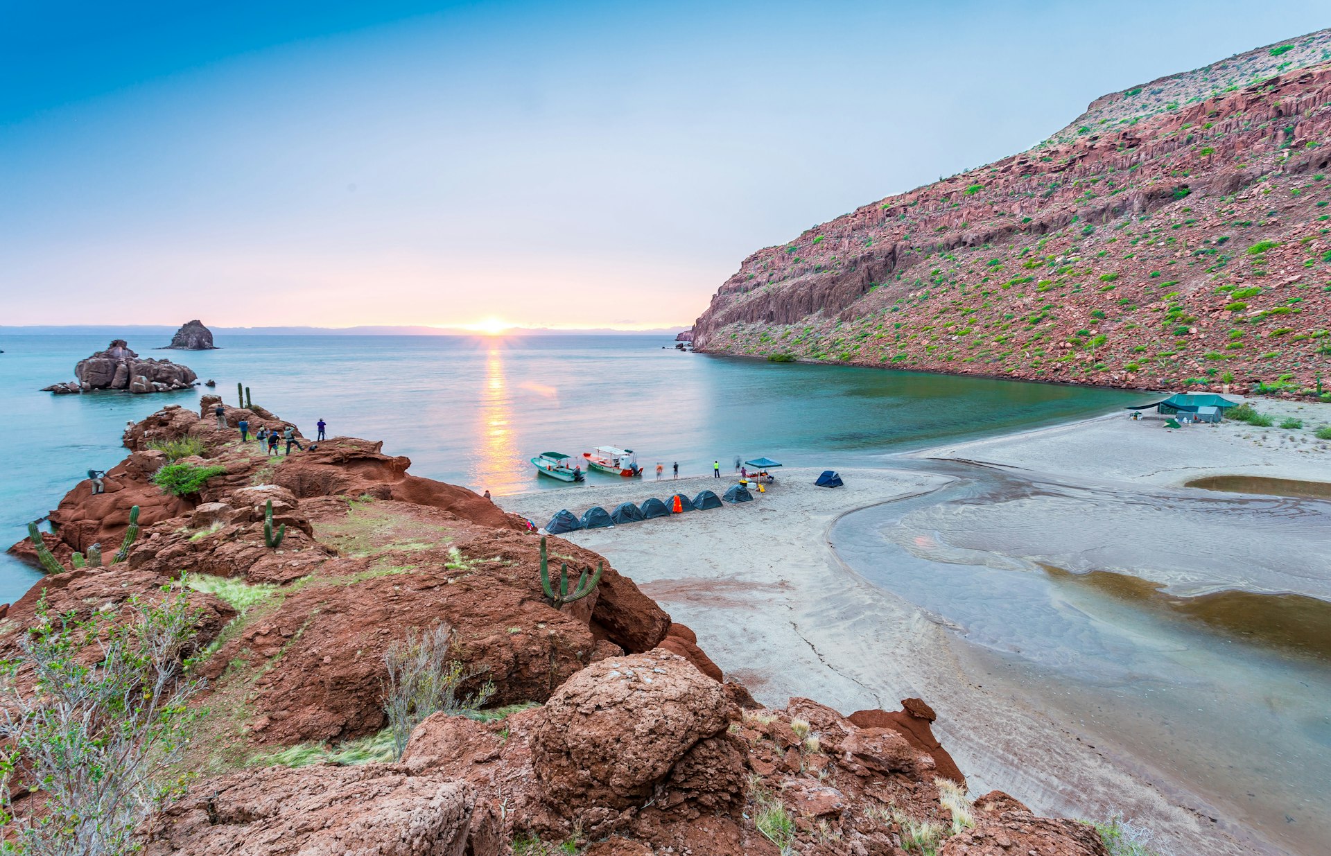 People set up camp on the beach on Isla Espiritu Santo during sunset