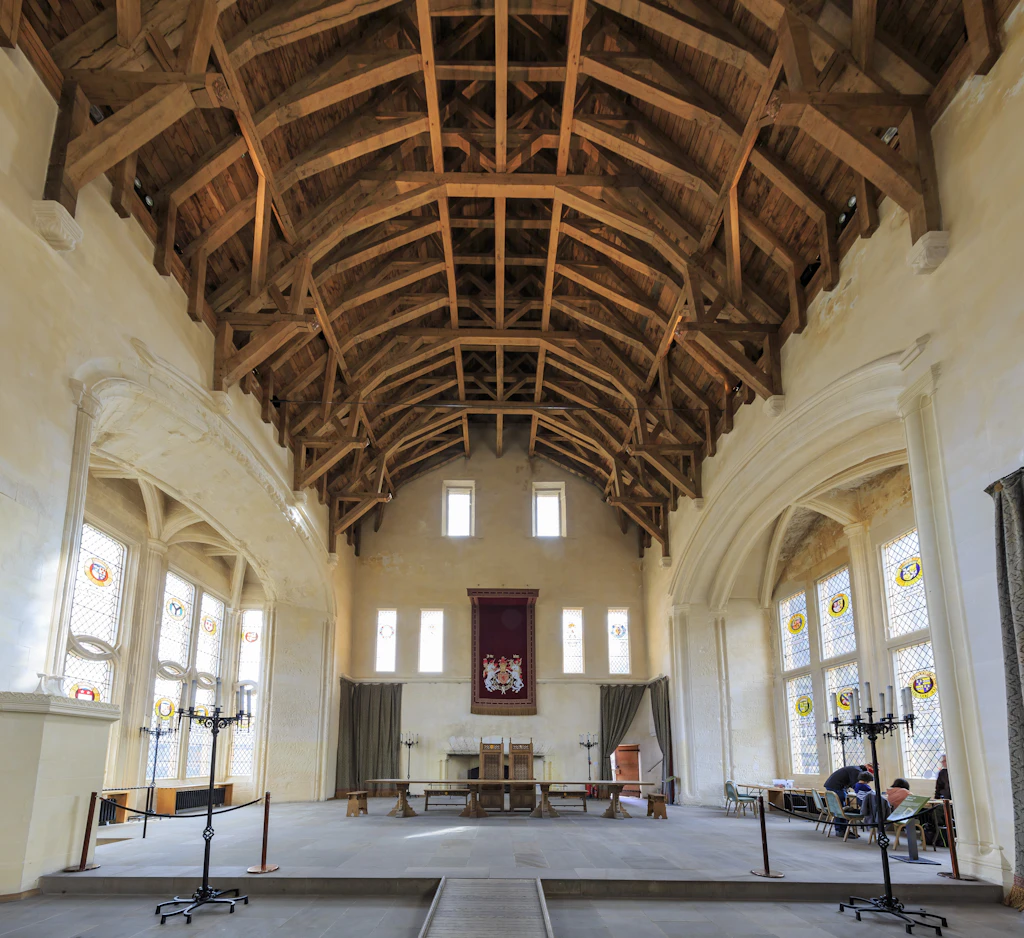 A huge meeting hall with an arched timbered ceiling