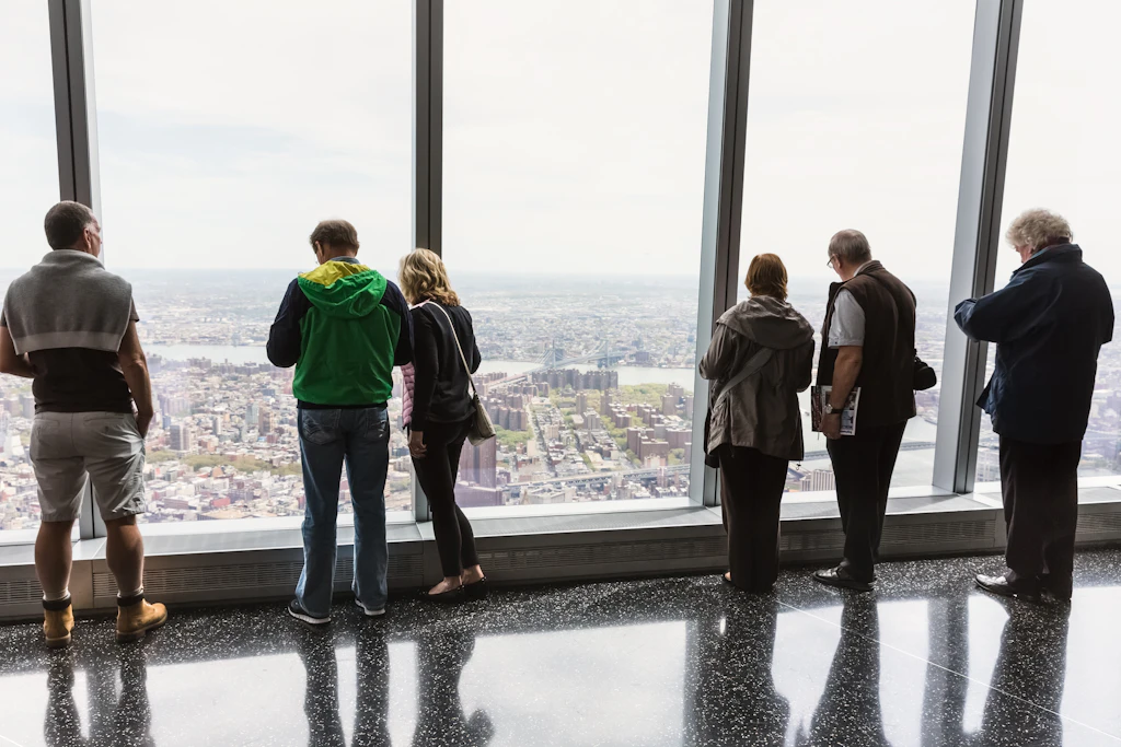 People looking through the One World Observatory windows
